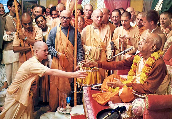 Srila Prabhupada gives initiation, accepting disciples